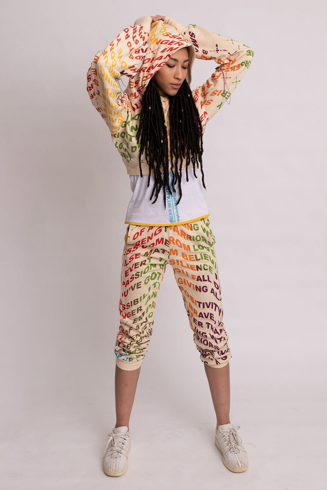 Woman in printed joggers and cropped hoodie