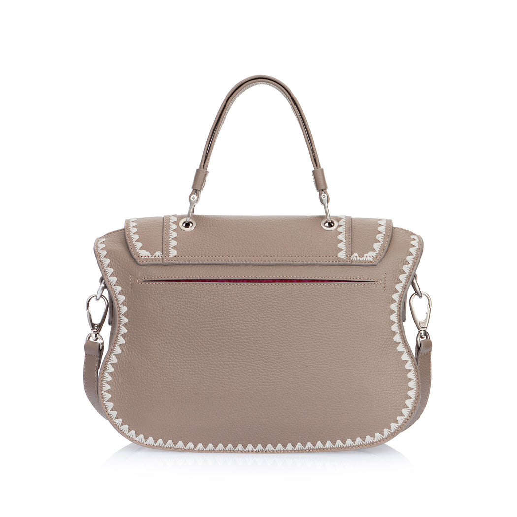 An instant statement luxury leather bag in taupe grained calfskin, the feminine curved lines and spacious interior ensures that the bag is both chic and functional. Can be comfortably worn on the shoulder as it features a removable shoulder strap. The signature curved flap is highlighted with beautiful ivory silk tulip contrast stitching.