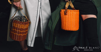 Brown and orange designer bucket bags made from woven material.