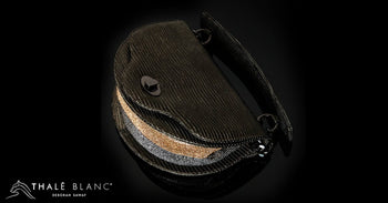 Beaded luxury handbag, crescent-shaped, black with gold and silver accents.