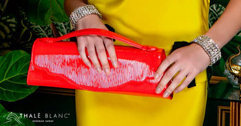 Red embossed designer evening clutch bag, made from Italian leather.