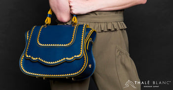 Blue designer women's satchel with yellow stitching. Made from Italian leather.