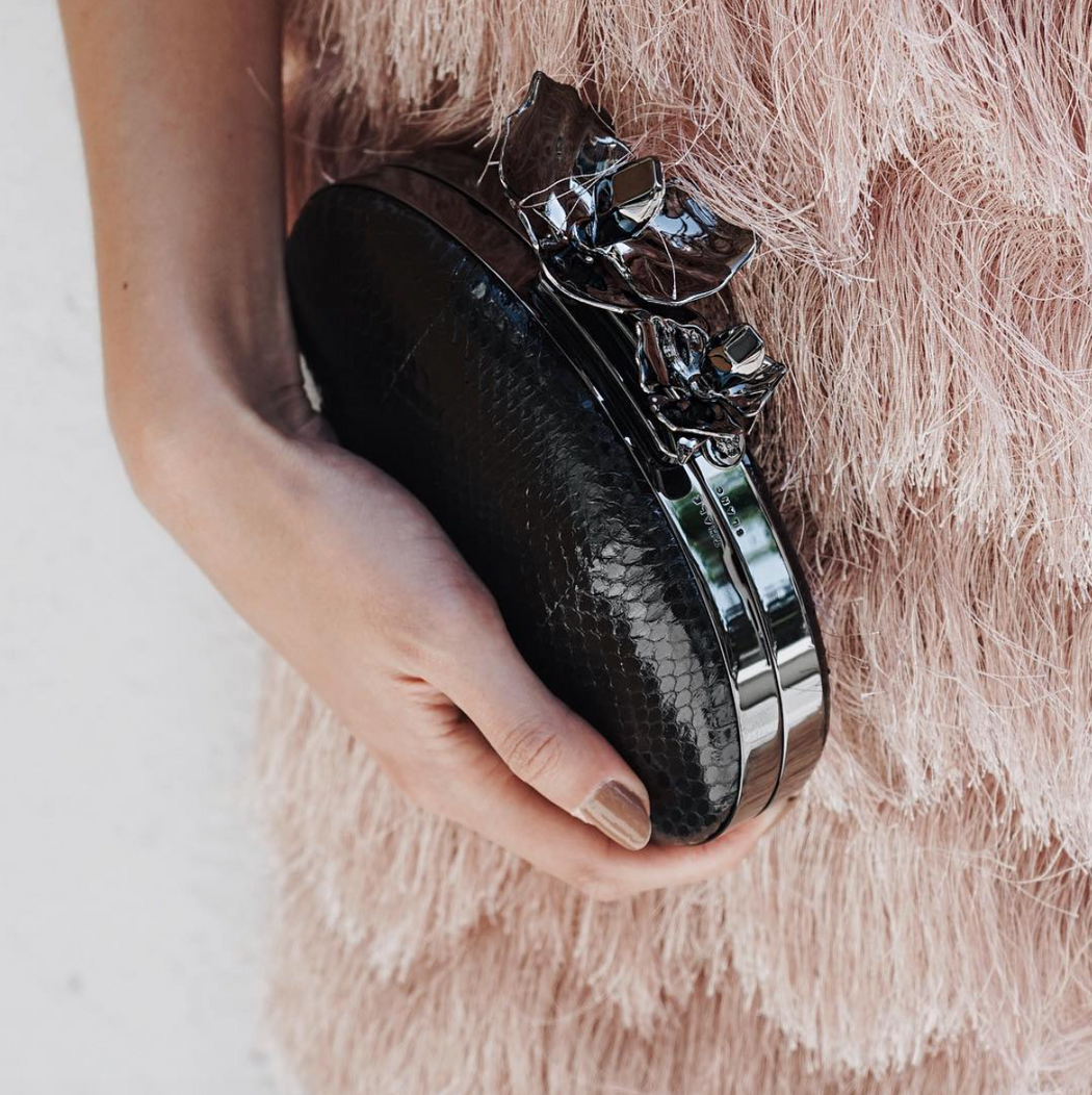 Oval clutch bag hotsell