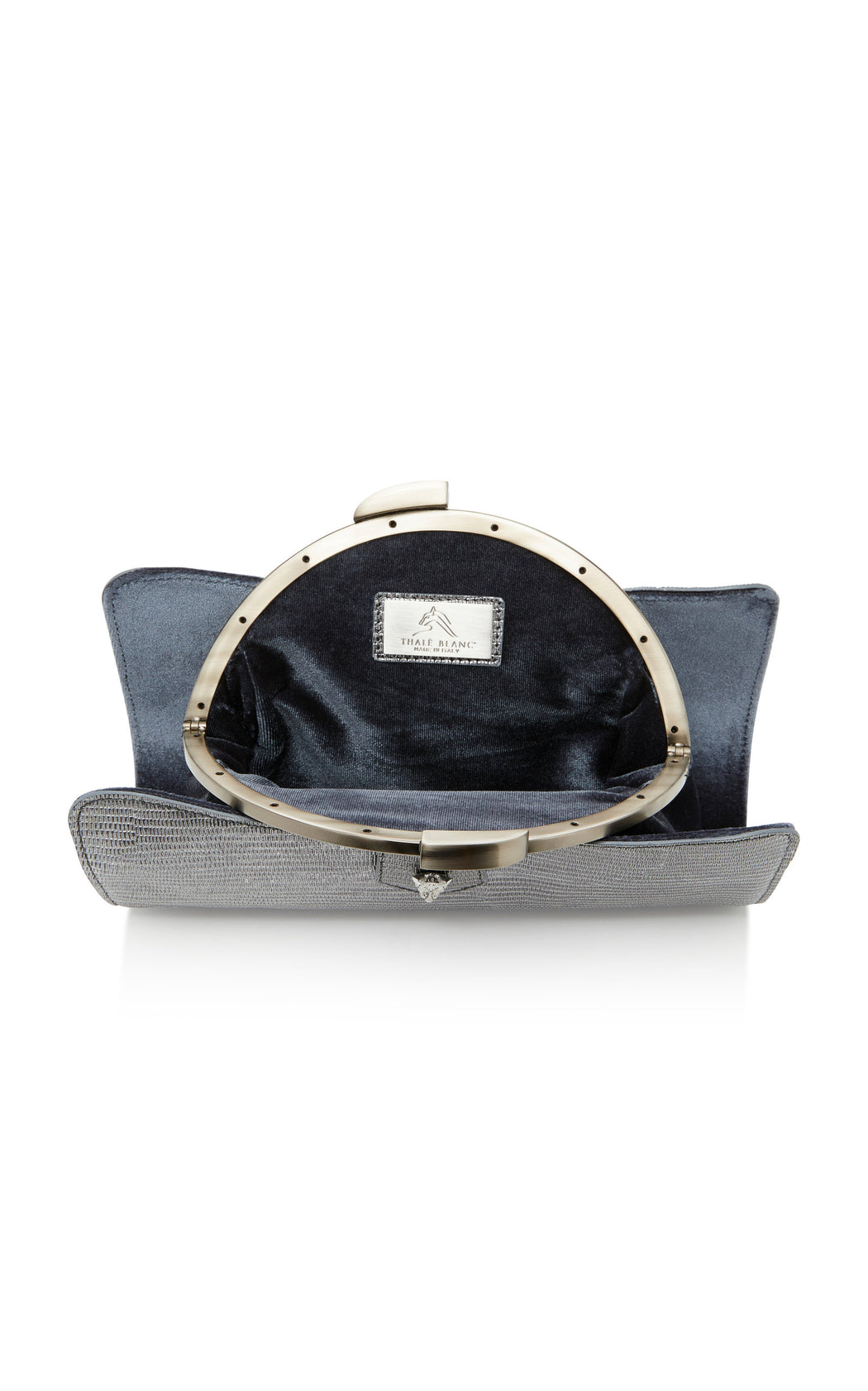 Two looks from one luxury handbag. Silver lizard-embossed calf leather outer layer reveals a rich gray velvet pouch with a gold-toned snap closure. Fits all size smart phones.